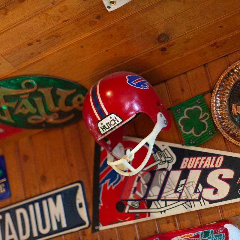 Image shows a vintage Buffalo Bills helmet mounted on the wall inside of GlenPatrick's Pub. 