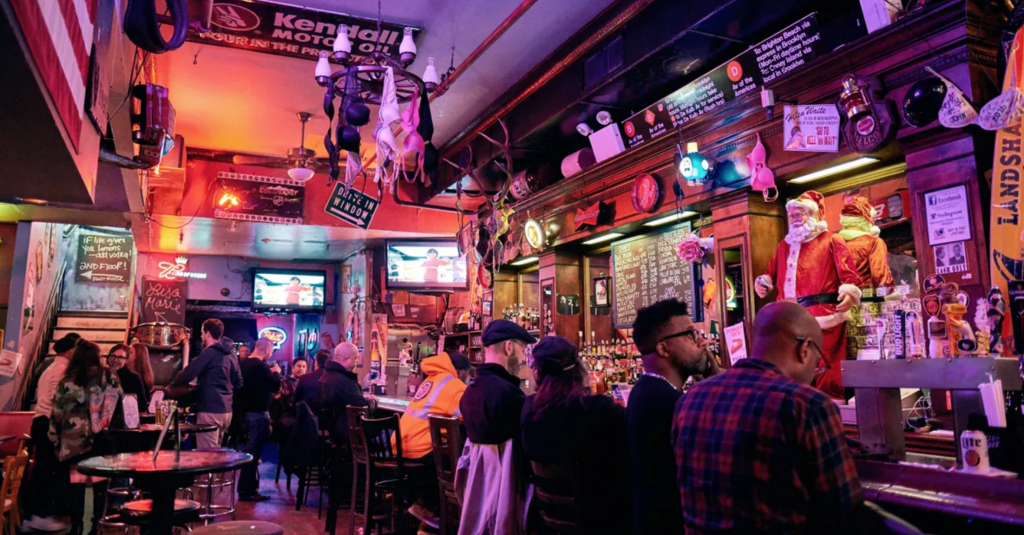 Image shows patrons inside of The Patriot Saloon.